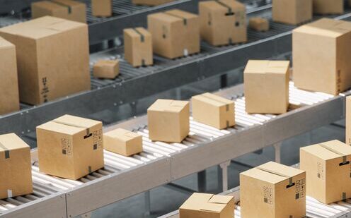 Cardoard-Boxes-on-conveyor-belt-GettyImages-1225833689-Med
